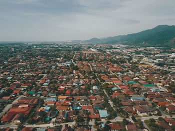 Aerial view of cityscape against sky