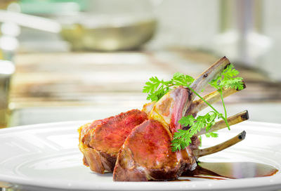Close-up of meat in plate on table