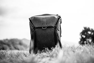 Bag on field against sky