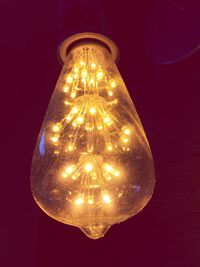 Low angle view of illuminated light bulb