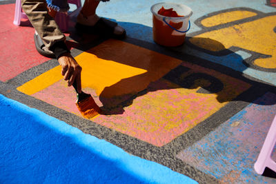 Low section of woman standing on table