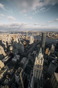 High angle view of modern buildings in city against sky