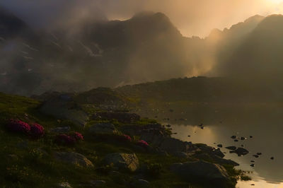 Scenic view of mountains against sky during sunset