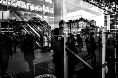 Rear view of people walking on street