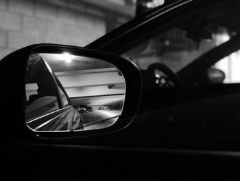 Reflection of car on side-view mirror