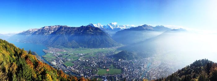 High angle shot of townscape against mountain range