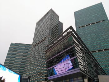 Low angle view of modern buildings against clear sky