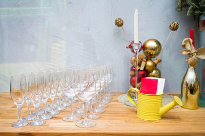 Holiday table with empty champagne glasses. the table is decorated for the new year.