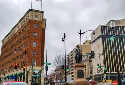 Buildings in city against sky