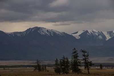 Scenic view of snowcapped mountains against sky