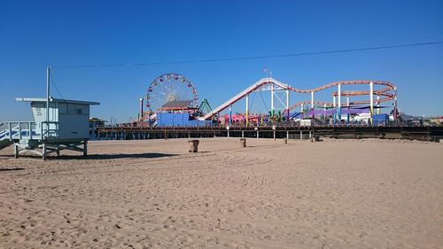Amusement park on santa monica pier against sky against sky