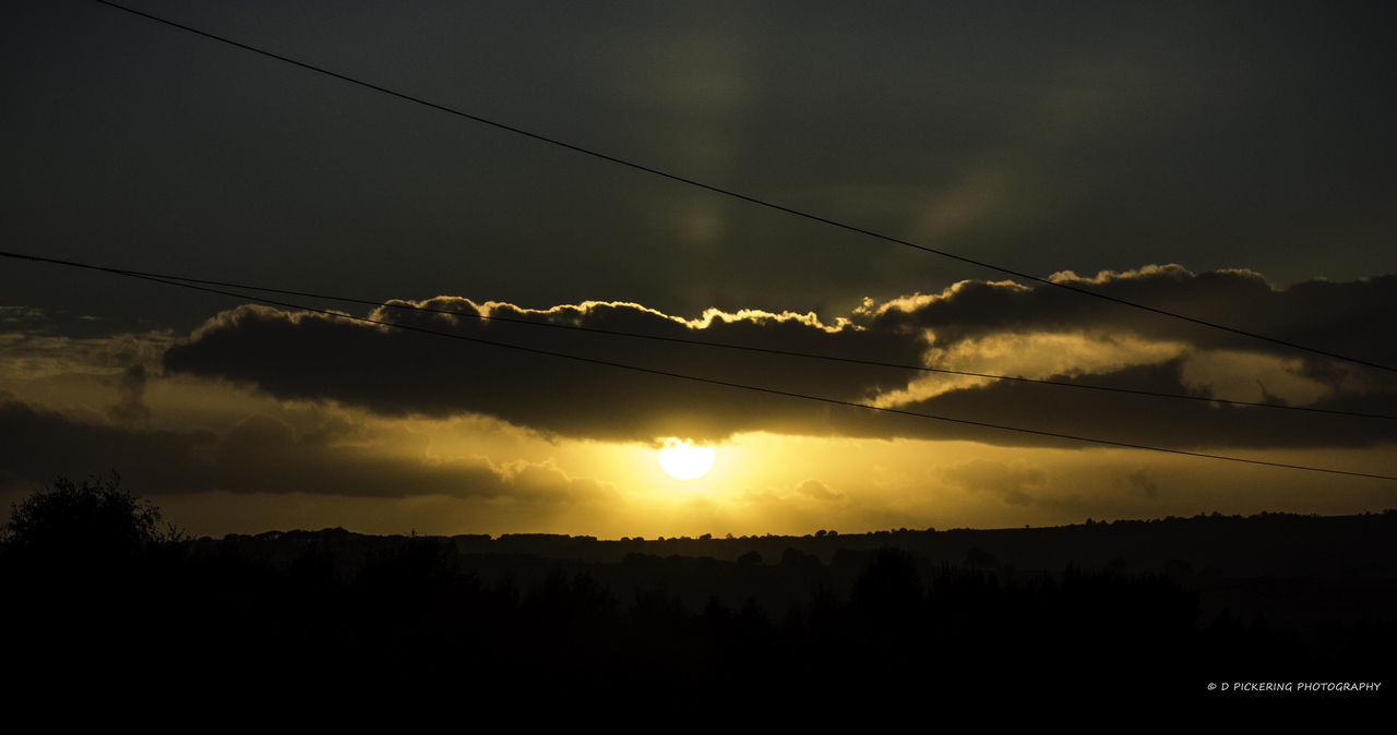 sunset, silhouette, scenics, sky, tranquil scene, beauty in nature, tranquility, cloud - sky, landscape, nature, power line, tree, idyllic, mountain, electricity pylon, electricity, dusk, outdoors, cloud, weather