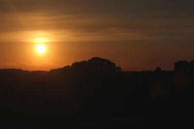 Scenic view of silhouette landscape against sky during sunset