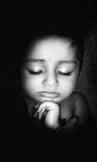 Close-up portrait of girl with eyes closed