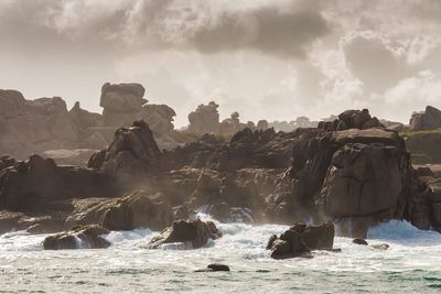 Scenic view of sea against cloudy sky