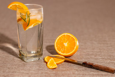 Close-up of drink against orange background