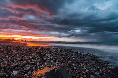 Scenic view of sea against sky during sunset