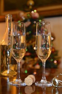 Close-up of wine glasses on table