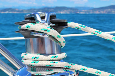 Close-up of rope tied to railing