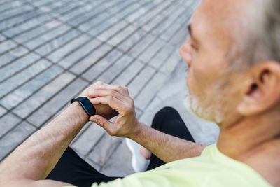 Man checking pulse in fitness tracker