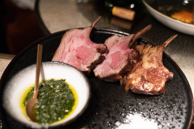 Close-up of meat in cooking pan on table