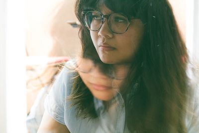 Double exposure of woman with brown hair