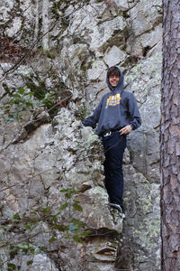 Portrait of man standing on rock