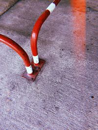 High angle view of red umbrella on wet street