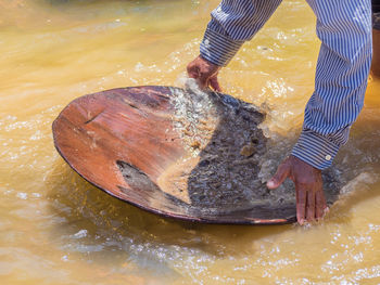 High angle view of man preparing food in water