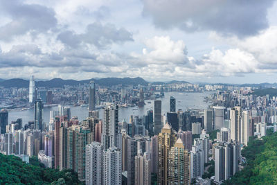 Cityscape against cloudy sky