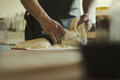 Midsection of man preparing food