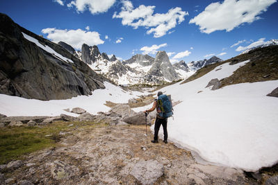 Hiker with backpack looking at view while standing at grand teton national park