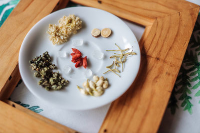 High angle view of fruits in plate on table