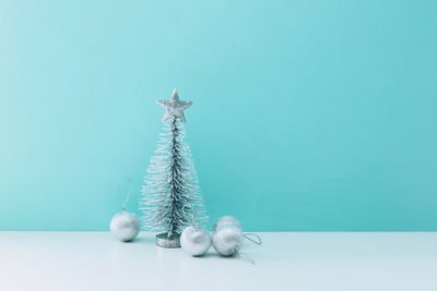 Decoration on table against blue background