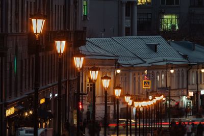 Illuminated street and buildings at night