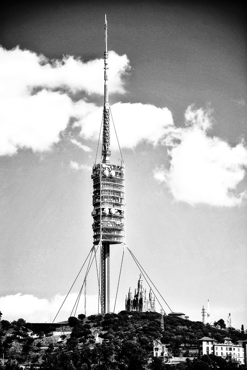 LOW ANGLE VIEW OF COMMUNICATIONS TOWER AGAINST SKY