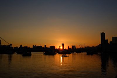 Silhouette of city at sunset