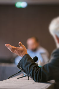 Portrait of man feeding on table