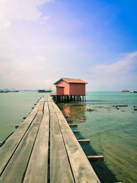 Pier over sea against sky