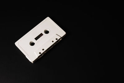 High angle view of telephone pole against black background