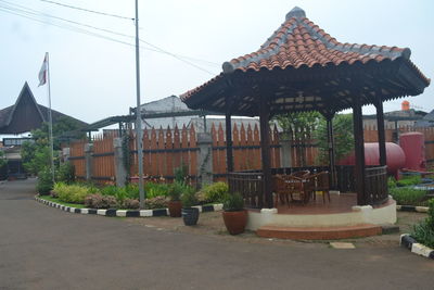 Traditional building by street against sky