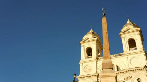 Low angle view of building against clear blue sky