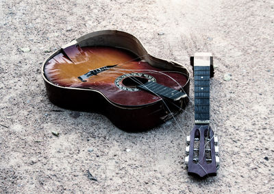 High angle view of guitar on sand