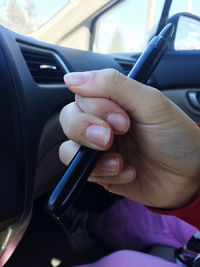 Midsection of person in car