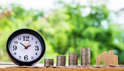 Close-up of clock on table