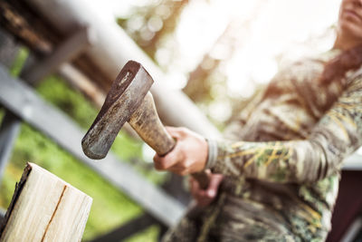 Woman chopping wood