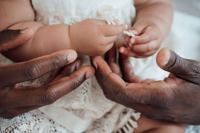 Midsection of woman holding hands