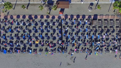 High angle view of people relaxing at beach