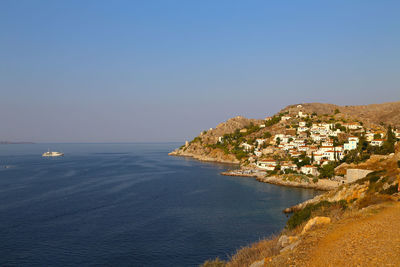 Scenic view of sea against clear blue sky