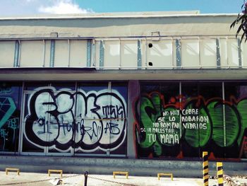 Graffiti on building against sky